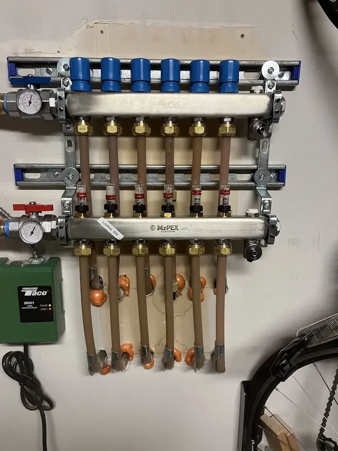 Plumber performing Gas Line Installation at a residential property in East Manchester